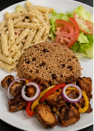 Haitian goat plate with mac and cheese and side salad at 509 Restaurant and Lounge